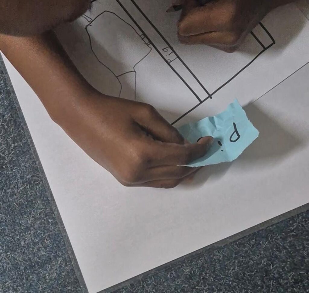 child doing phonics worksheet